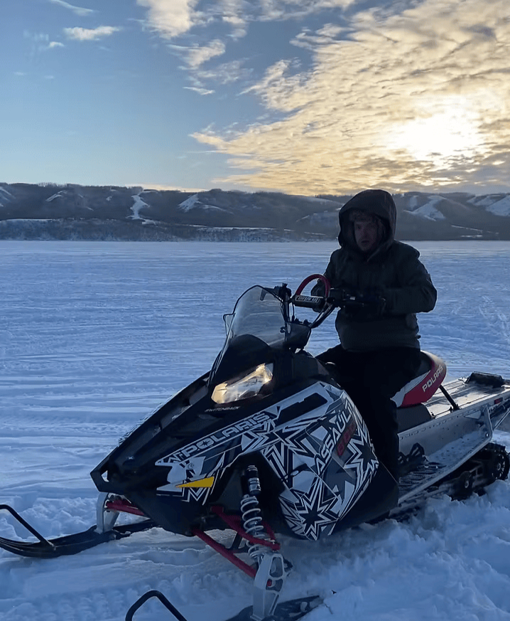 andrewdrivingasnowmobilecropped